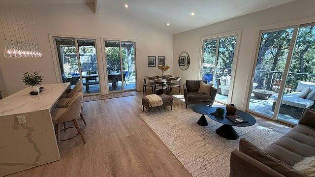 Open Concept Living/Dining/Kitchen opens to large deck for outdoor dining/entertaining