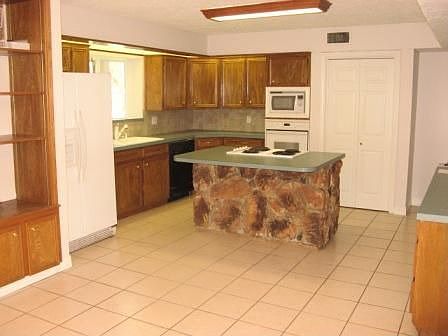 This spacious kitchen will be a joy to wipe up something good to eat.