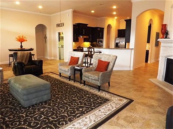 The family room has an open flow with the kitchen and offers plenty of space to entertain family and friends.