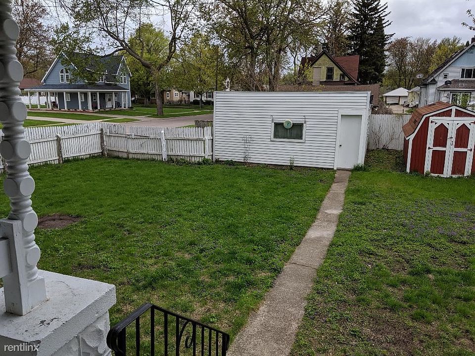 Back yard with garage and shed
