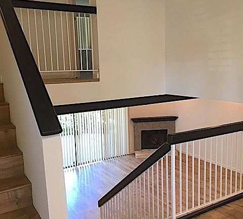 View to Living Room and Upstairs to Master Bedroom
