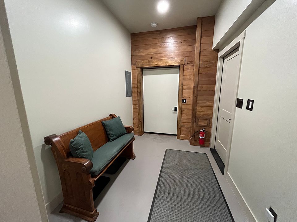 Outside entrance to Foyer of Barn House Loft. Parking garage is located thru the door on the right.