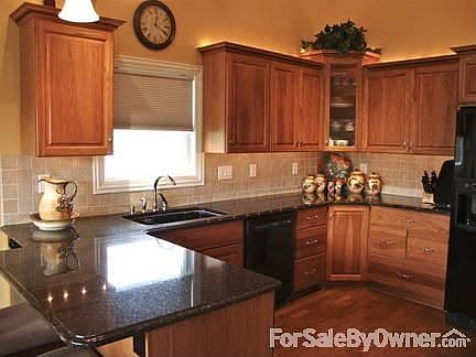 Custom cherry glazed hickory cabinets : Granite counters, above and under cabinet lighting. Hardwood