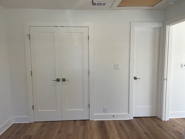 Doors to closet and bathroom in bedroom ensuite 1