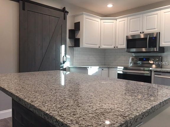 Large kitchen island will satisfy the chef in the family and provide plenty of additional counter space.