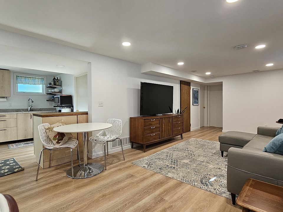 Large basement open concept kitchenette and living room