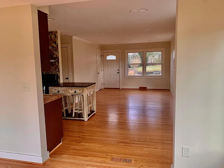 Spacious open floor plan and natural flow between living area, kitchen, and dining room
