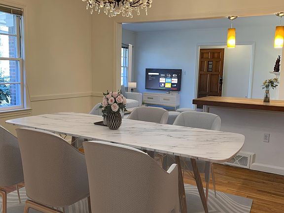 Dining room with custom counter, dimmable chandelier