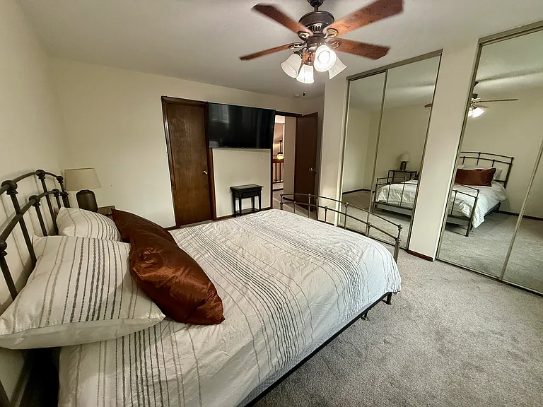 Primary bedroom: spacious, bright, big closets, connects to upstairs bathroom