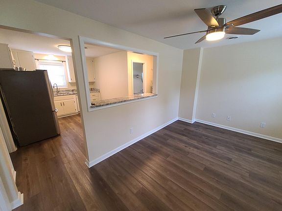 View from front door of Living Room, Kitchen and Bathroom