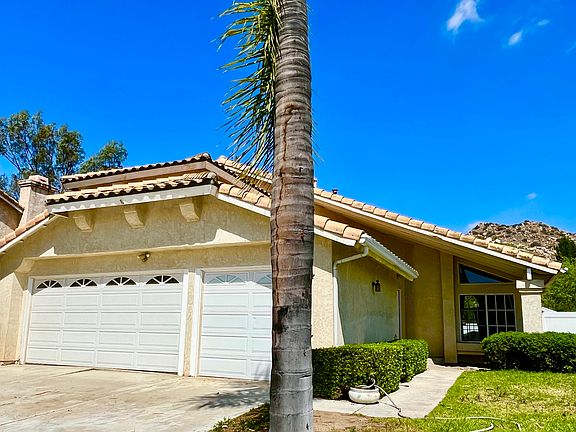3-car garage and wide and long driveway