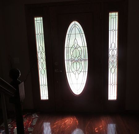 Front Door
						:
						Side panels in this premium leaded glass door provide extra light in entry hall.