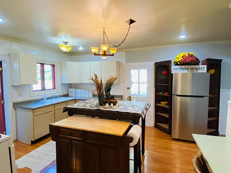 The large kitchen has space for a sideboard, desks, china cabinet, or buffet!