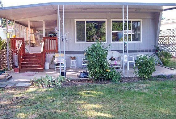 Front of home with patio.