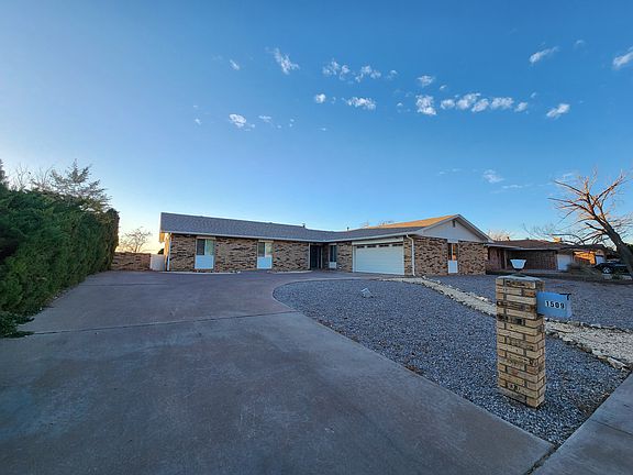Large driveway and attached two car garage