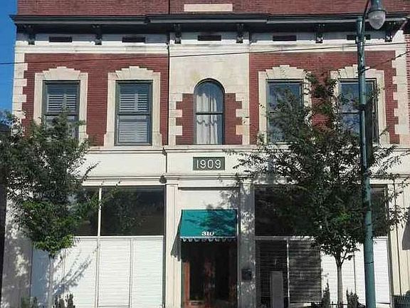 Beautiful historic building right in the middle of it all. The 3 right most windows on the upper level are the main bedroom!