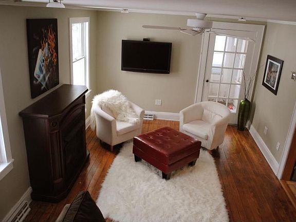 Living room w/hardwood +fireplace
