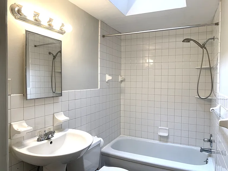 Upper level full bathroom with opening skylight