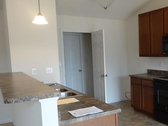 Kitchen w/ side by side refrigerator