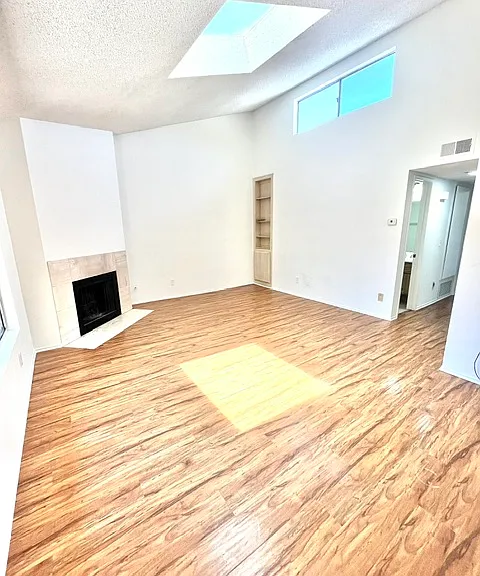 Living room with previous floors in similar unit