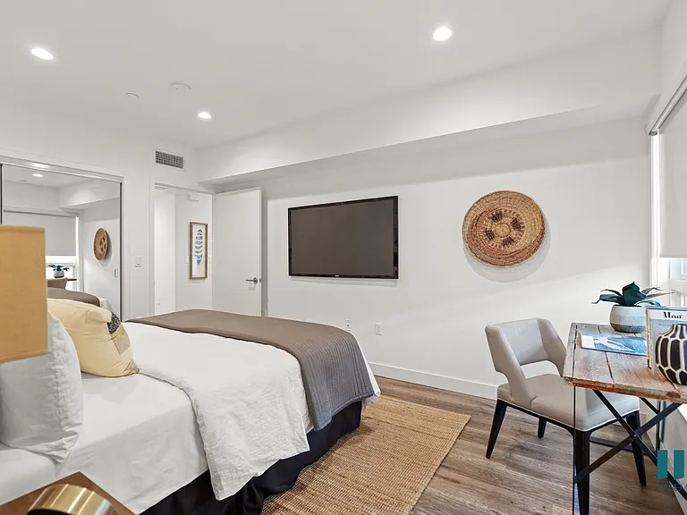 Bedroom with Mirrored Closet, Vinyl Flooring, and Recessed Lighting