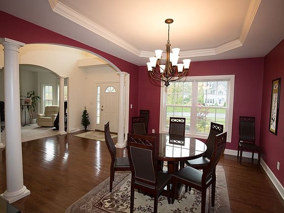 12' x 15'  Tray ceiling, arched opening, columns, hardwood floor.  Butler Pantry w/granite counter