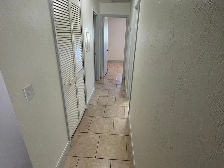 Walk in the hallway, at the end on the left is the master bedroom...