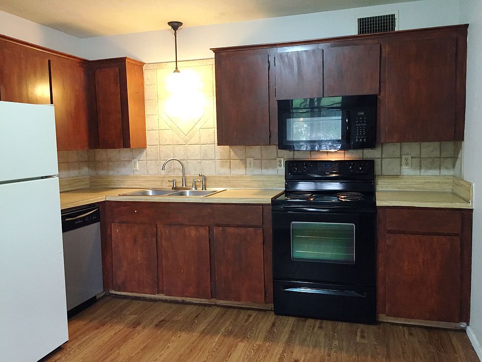 Tile Backsplash, deep stainless sinks, built in microwave, electric rangee, garbage disposal, dishwasher, washer dryer, lots of room for a dining table
