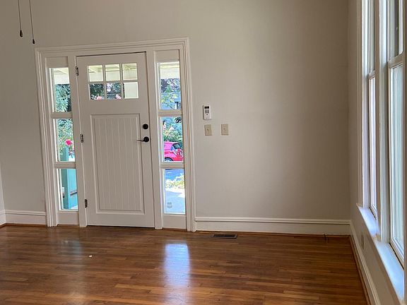 Filled with Natural Light, original hardwoods & non working fireplace