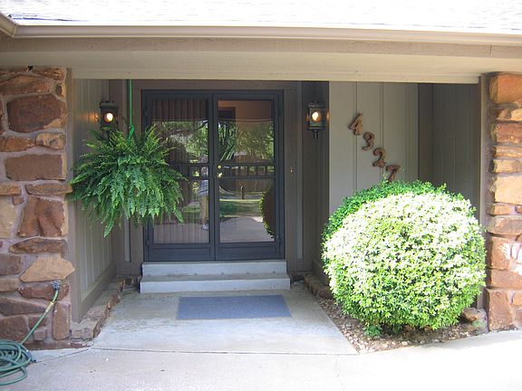 Front double door with double storm doors.
