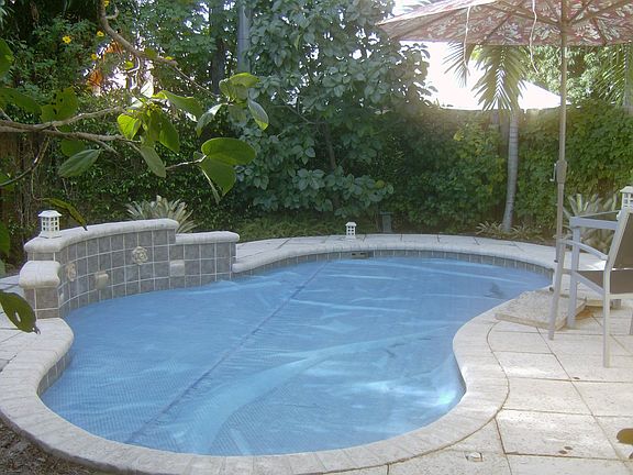 Heated pool, patio and private backyard.