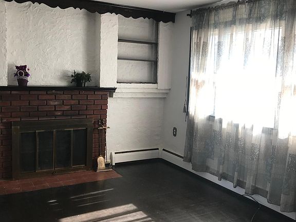 Living Room with fire place and built in shelves