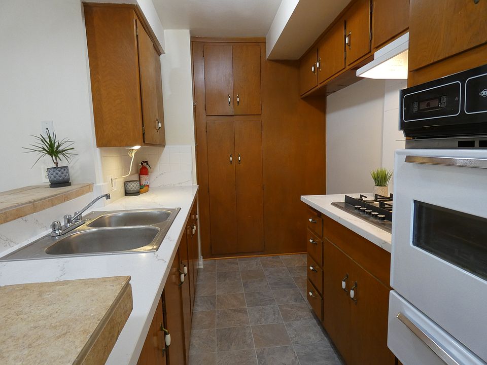 Full feature kitchen. Does not have refrigerator, but apartments #5 & 6 do at no extra cost. The front end of the counter on the left has book shelves.