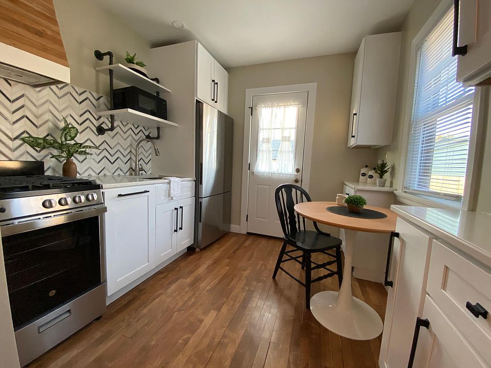 This is a photo of one of our other kitchens (in a different unit). Your unit would have the same white shaker cabinets but dark countertops
