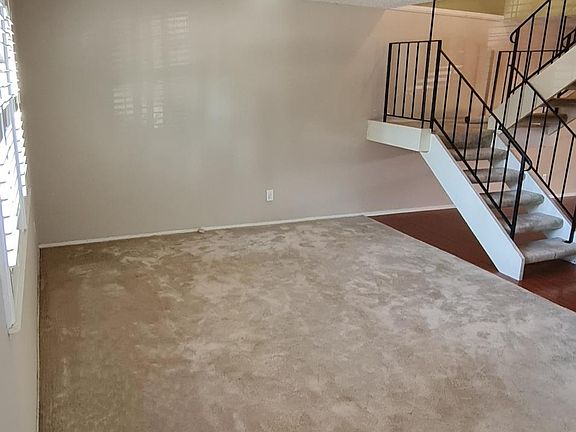Living room angle from front door with staircase in the rear