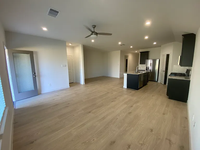 Open kitchen, dining room, and living room