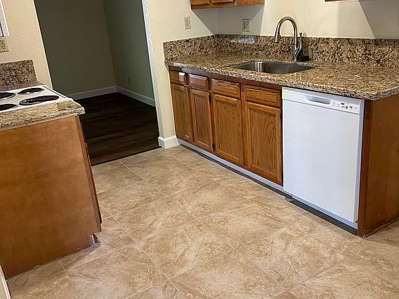 kitchen w new flooring and new granite counters
