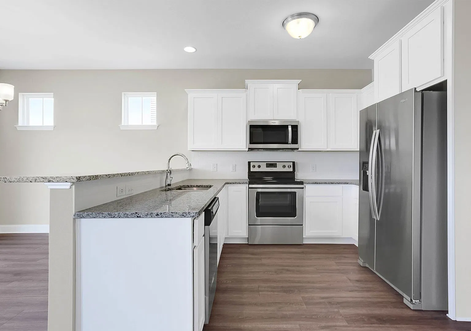 Beautiful home with a charming wrap-around front porch and open floor plan! — Photo 4