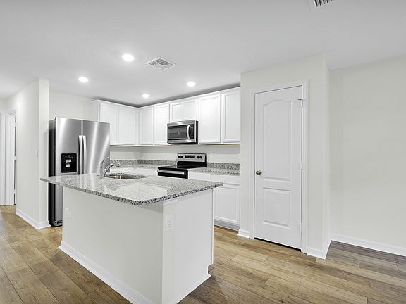 The kitchen of the Brickell has a large island, perfect for hosting