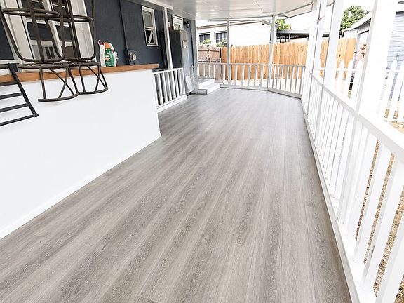 Large covered outdoor porch/deck (back)