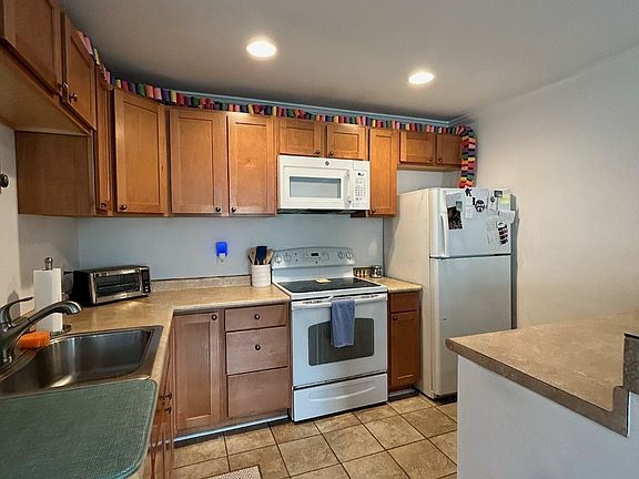 Fully equipped kitchen with full-size appliances, ample counter space, and everything you need to cook and dine
