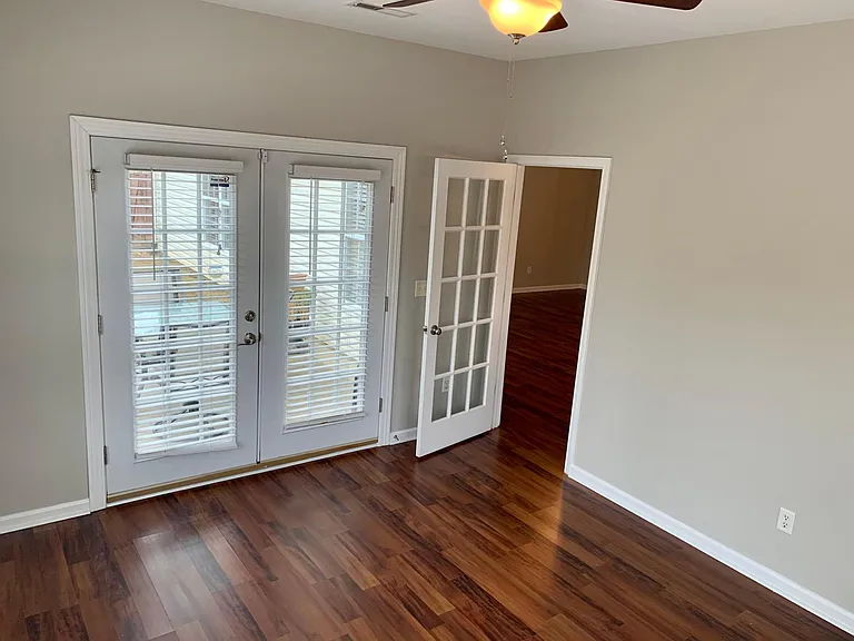 French doors leading to back yard in the sunroom........