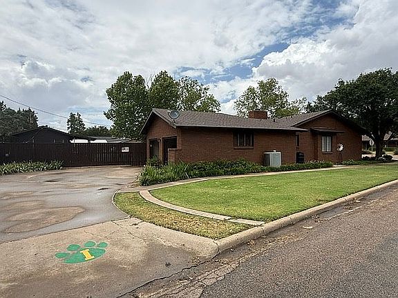 Garage and large driveway.