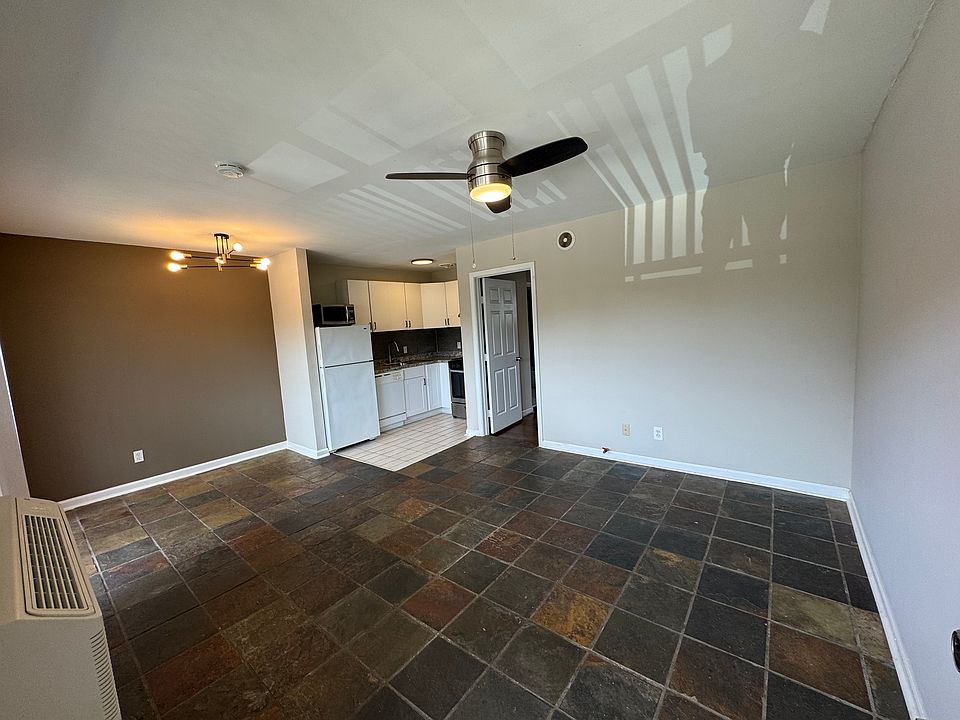 View from the front door. Note new light fixtures and ceiling fan.