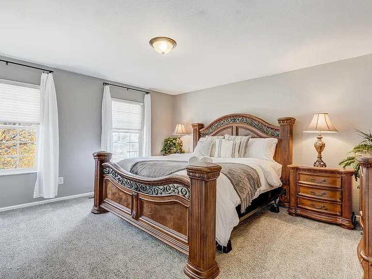 Master bedroom with a king sized bed and great natural light