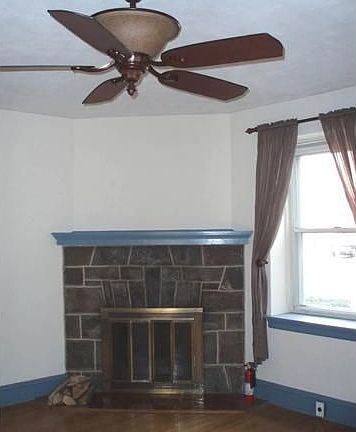 Living room with woodburning fireplace