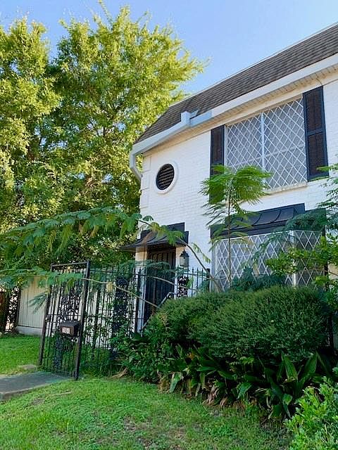 Sidewalks with mature trees surround this townhome. Easy access to street and secured, covered parking for 2 cars.