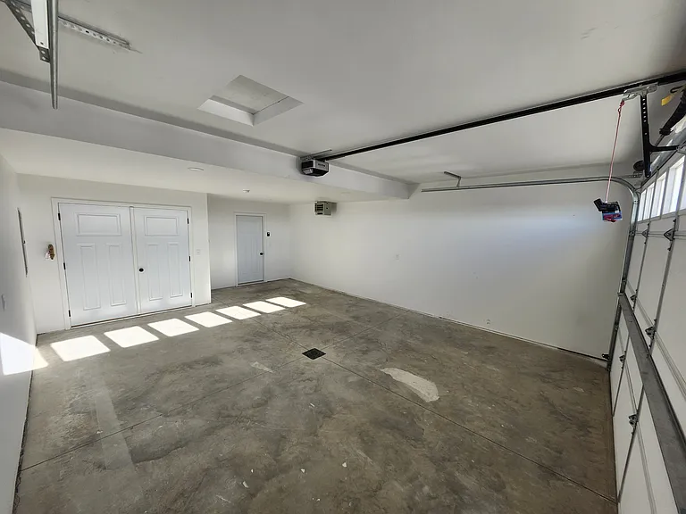 Heated two stall garage. (Pictures are of another unit with similar finishes and features.)
