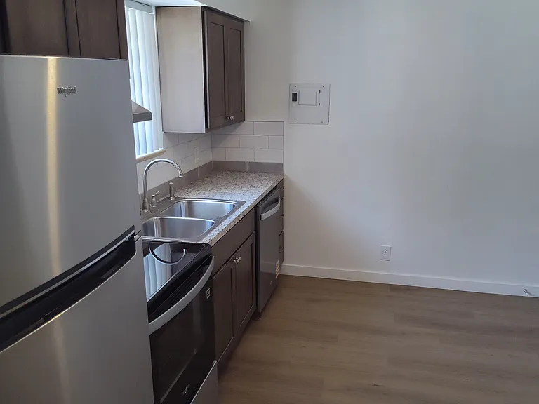 Kitchen standing by the backdoor.