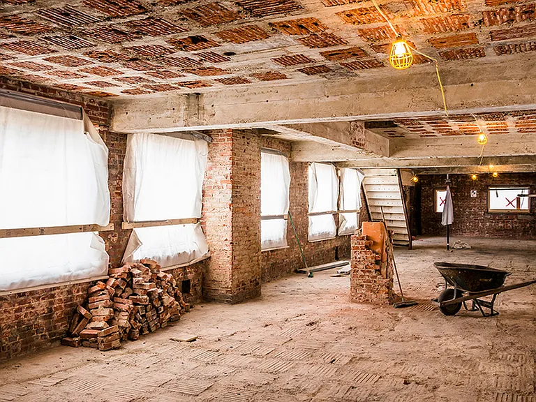 Before: Exposed brick during renovation